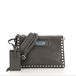 Gray Prada studded Etiquette bag in calfskin leather lined in blue suede.